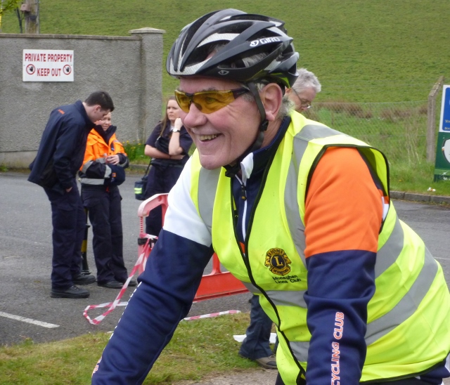 Volunteer helping with marshalling along the 10k route