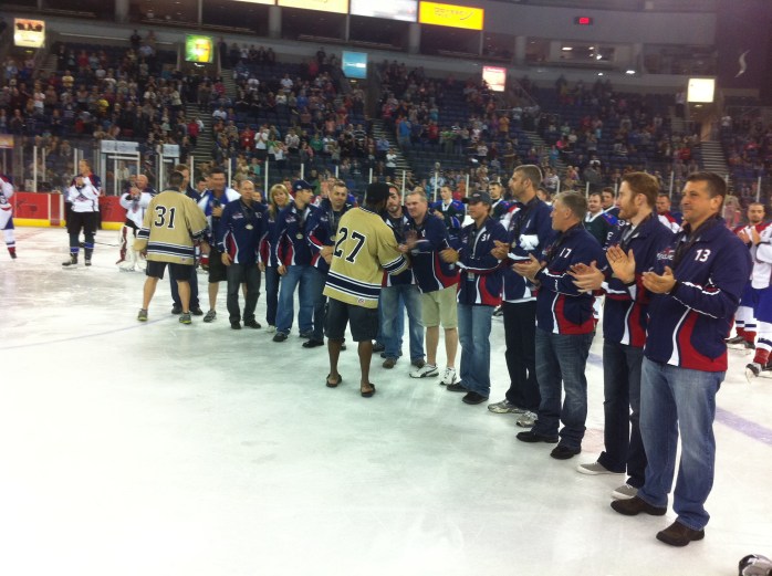 Gold medallists Toronto Courts congratulate North America Blue (silver medallists)