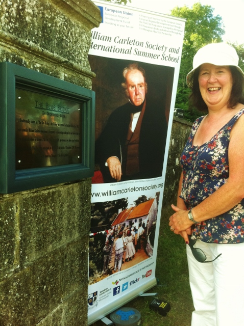 Breege Lenihan, Tullyvogey, Tydavnet inspects the restored plaque at the Blue Bridge Photo: © Michael Fisher