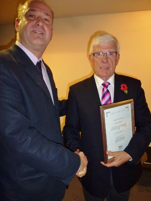 IEC Cathaoirleach Gerry Curran presents Ray Managh with his life membership award Photo: © Michael Fisher