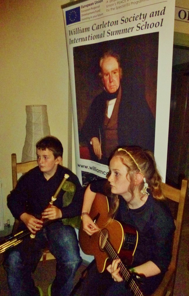 Peter Mc Kenna (uilleann pipes) & his sister (guitar) at Somers café Fardross  Photo: © Michael Fisher