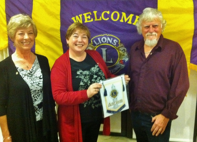 Zelda & Ray Jones Vera Lions Club are presented with an Antrim Lions pennant by Lion President Karen McCormack  Photo: © Michael Fisher