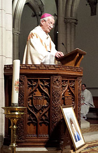 Archbishop Peter Smith inducts Mgr Hudson as Parish Priest Photo: Southward Archdiocese website