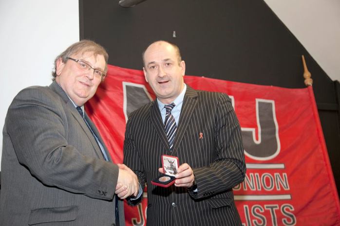 Michael Fisher presented with 1913 lockout centenary coin by Gerry Curran  Photo:  © Kevin Cooper