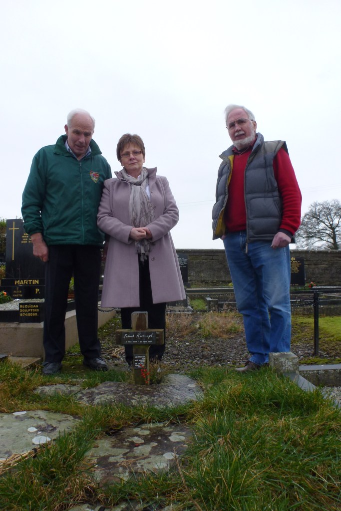 Patsy McKenna, Rosaleen Kearney and Art Agnew at Patrick Kavanagh's grave, Inniskeen  Photo:  © Michael Fisher    