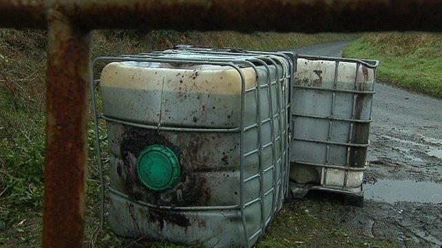 Containers filled with toxic diesel sludge abandoned at a roadside in Co. Monaghan  Photo: RTÉ News 2012