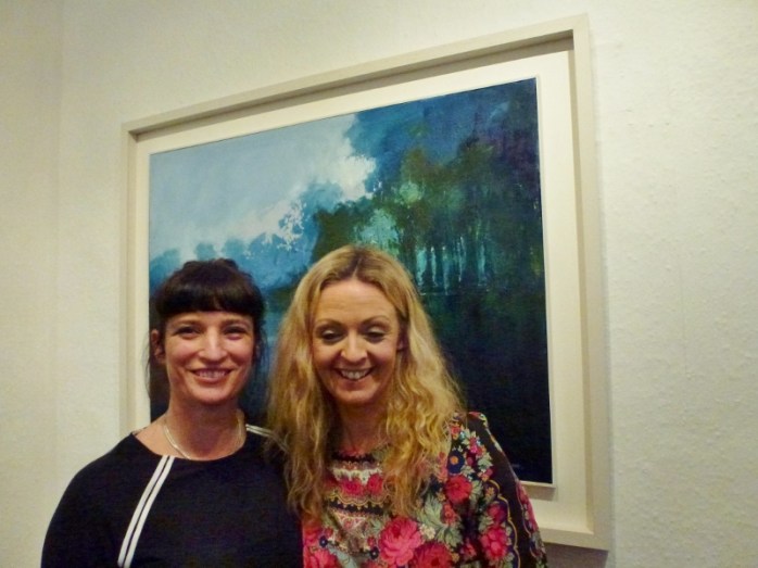 Doorway Gallery owners Deirdre Carroll and Denise Donnelly with Kate Beagan's painting 'Reflection'  Photo:  © Michael Fisher