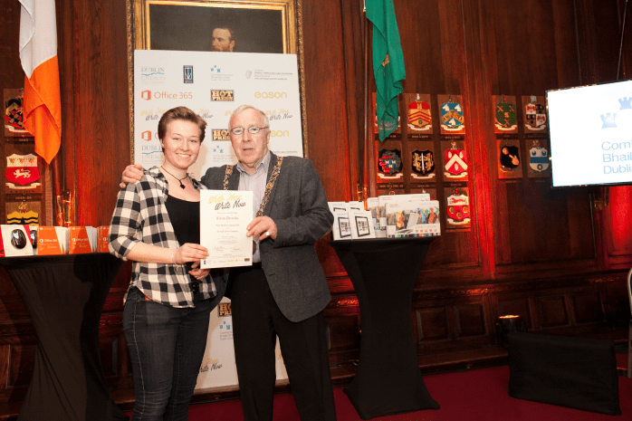 Alicia Ehrecke of Inver College, Carrickmacross, receives a 'Very Highly Commended' Hot Press award for her short story from the Lord Mayor of Dublin, Cllr Christy Burke Photo: Hot Press