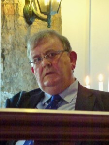 Michael Fisher listening to the speakers he introduced  Photo:  © Evelyn Fisher