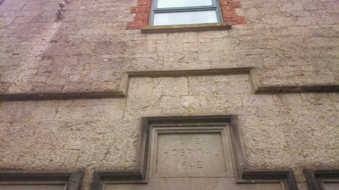 Stone Plaque above front entrance at former Fever Hospital, Carrickmacross, showing construction date 1842   Photo:  © Michael Fisher
