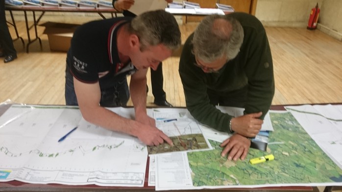 Checking the details of the EirGrid N/S Interconnector plan at the information meeting in Aughnamullen  Photo:  © Michael Fisher
