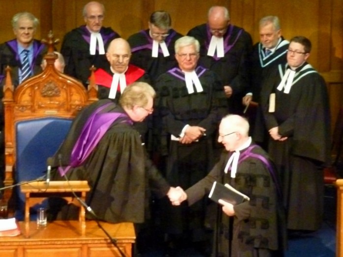 Reverend Stephen McNie, Monaghan (right), watches as his father Reverend Ian McNie takes over from Dr Michael Barry as Presbyterian Moderator  Photo:  © Michael Fisher