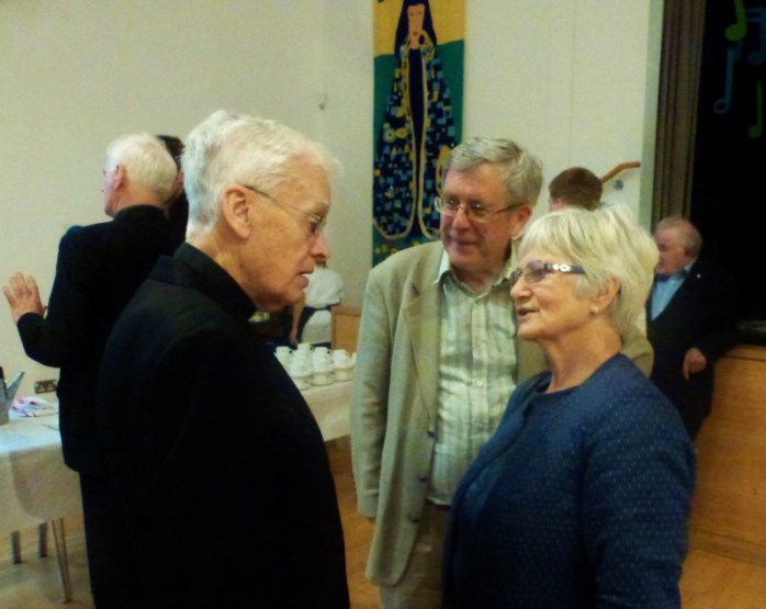 Canon Brian McCluskey with parishioners Eamon Hanna and his wife Carmel, former MLA for South Belfast. Photo:  © Michael Fisher