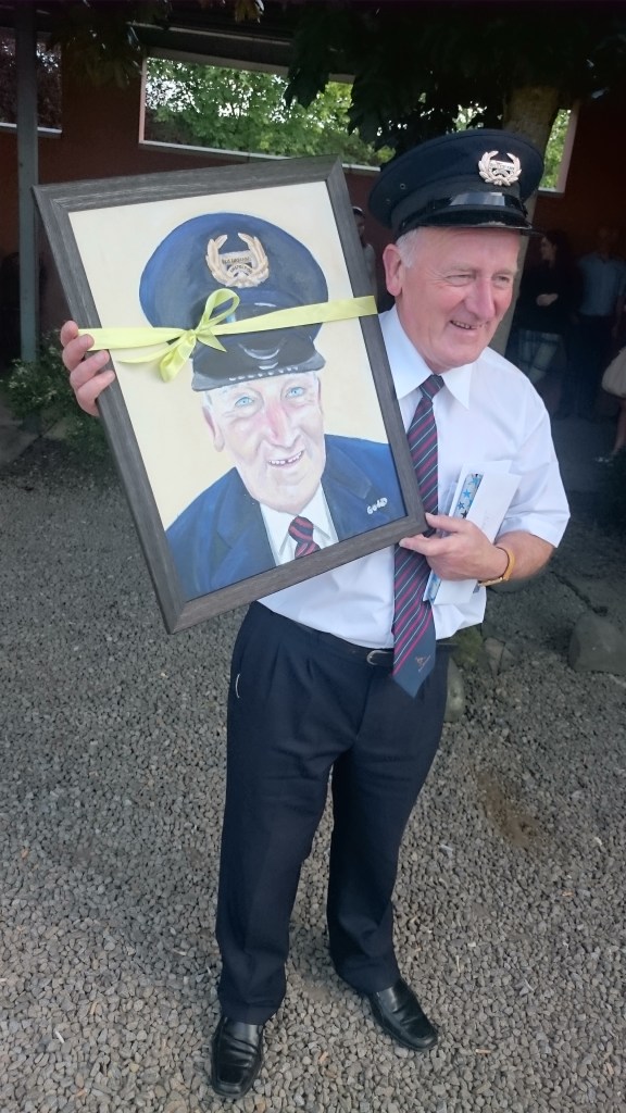 Paddy Gollogly with the portrait painted by one of the Dinkin's cafe staff, Goda Sirutyte  Photo:  © Michael Fisher