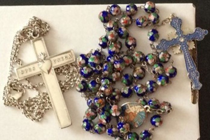 Sr Phil's RSCJ cross and rosary. recovered from the plane wreckage, were among the items stolen last month from her sister's home in Richmond, Victoria  Photo: Victoria Police